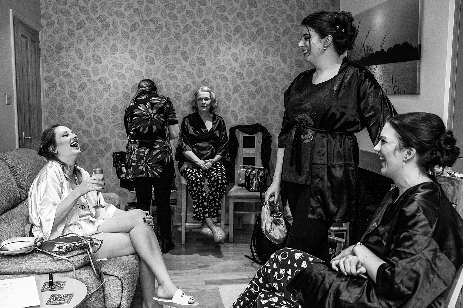 scene of bride and bridesmaids getting ready at home by Beckenham Wedding photographer