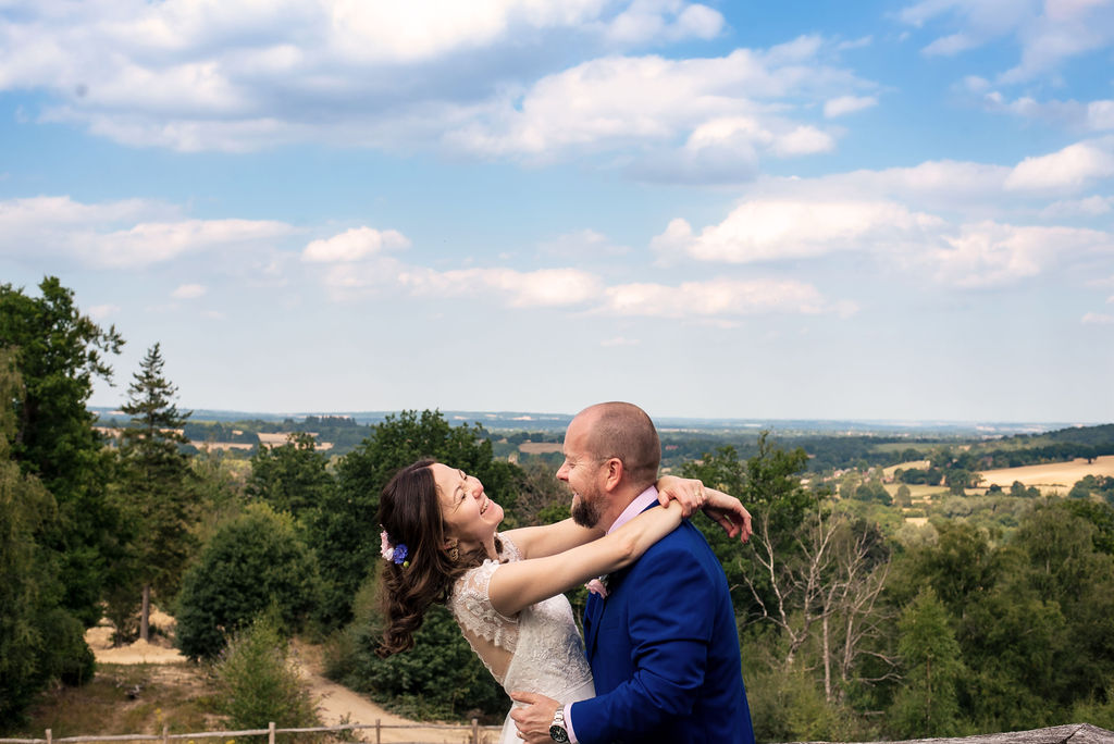 couple portrait with Kent countryside view at Kingdom in Penshurts by Piccolino Weddings