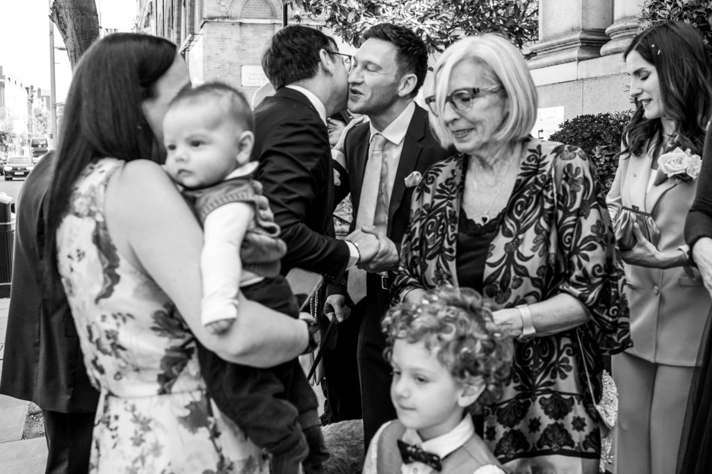 wedding guests outside Chelsea Town Hall
