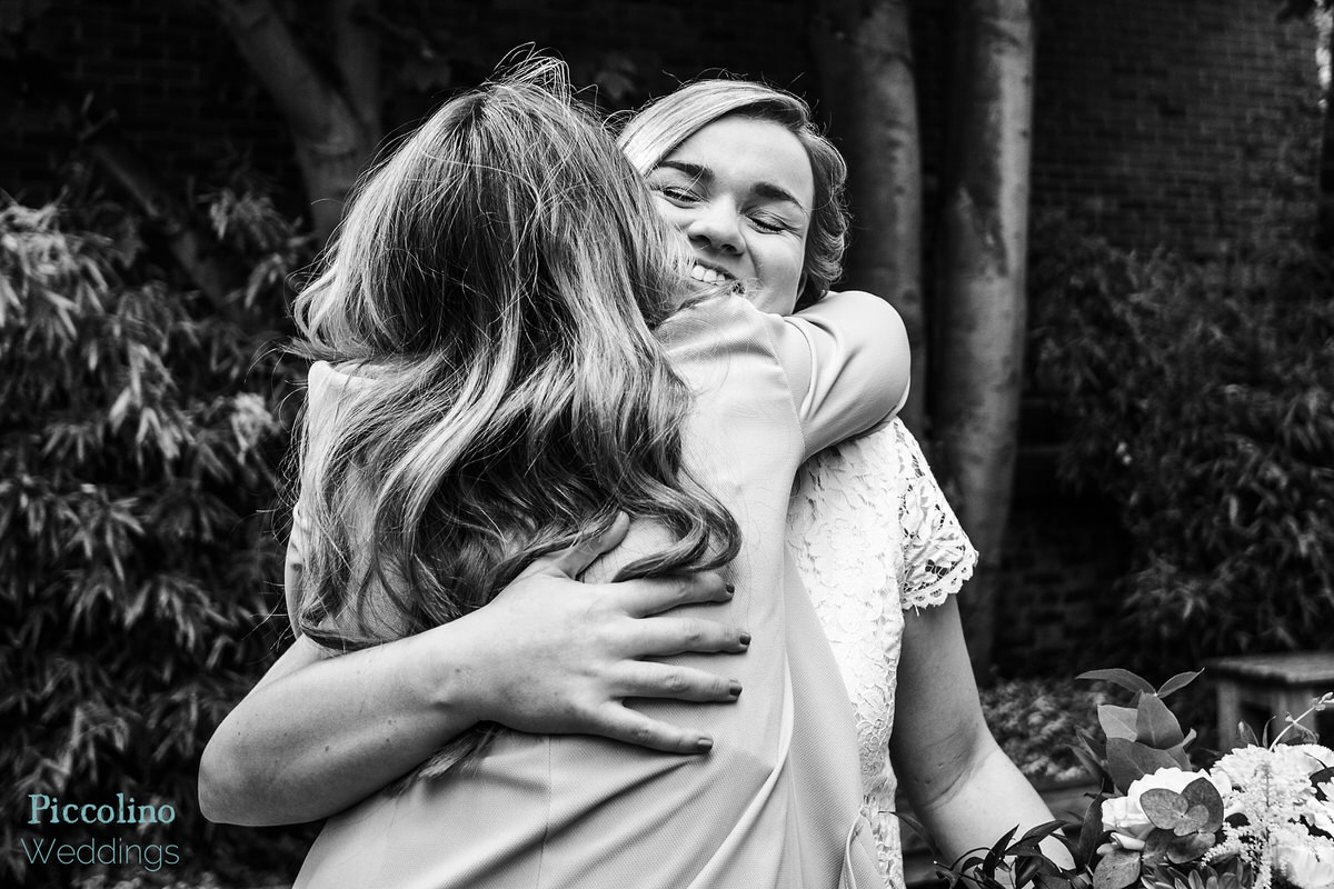 Bride hugging her bridesmaid at the Rosendale