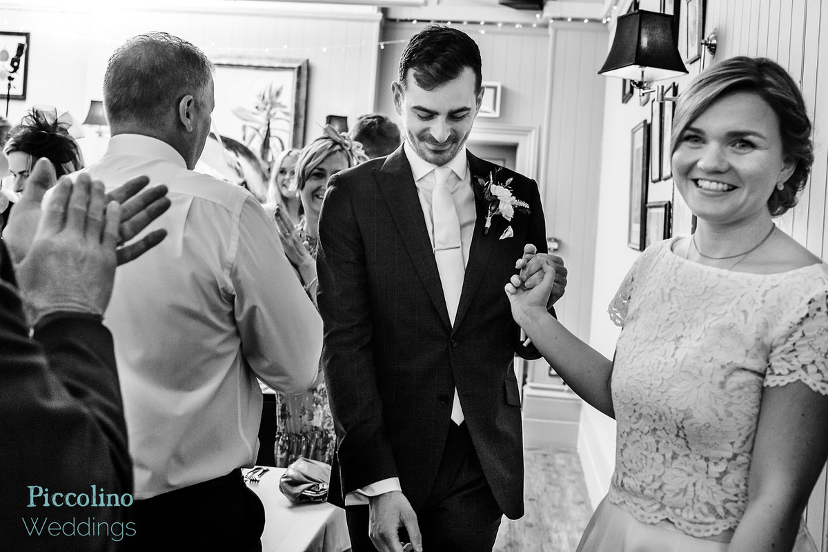 Couple entering the ceremony/reception room at the Rosendale for the wedding reception