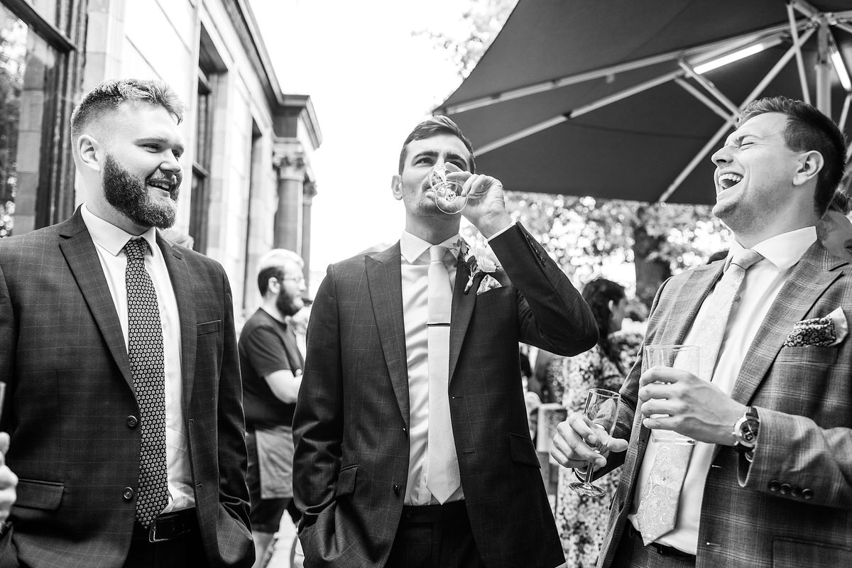 Groom and his mates drinking in the garden of the Rosendale Pub in Dulwich South London