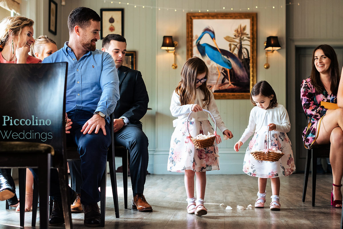 Flower girls walking entering the ceremony at the Rosendale in Dulwich London