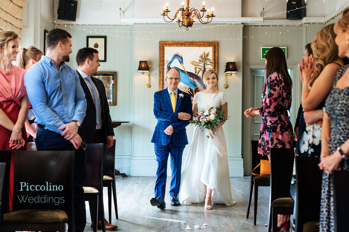 bride and father of the bride entering the ceremony at the Rosendale in Dulwich in London