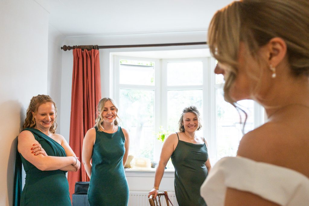 moment between bride and father of the bride during wedding preparation
