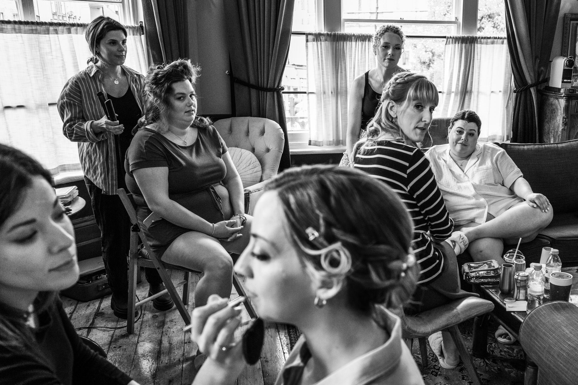 preparation shot of bride and bridesmaids doing their make up