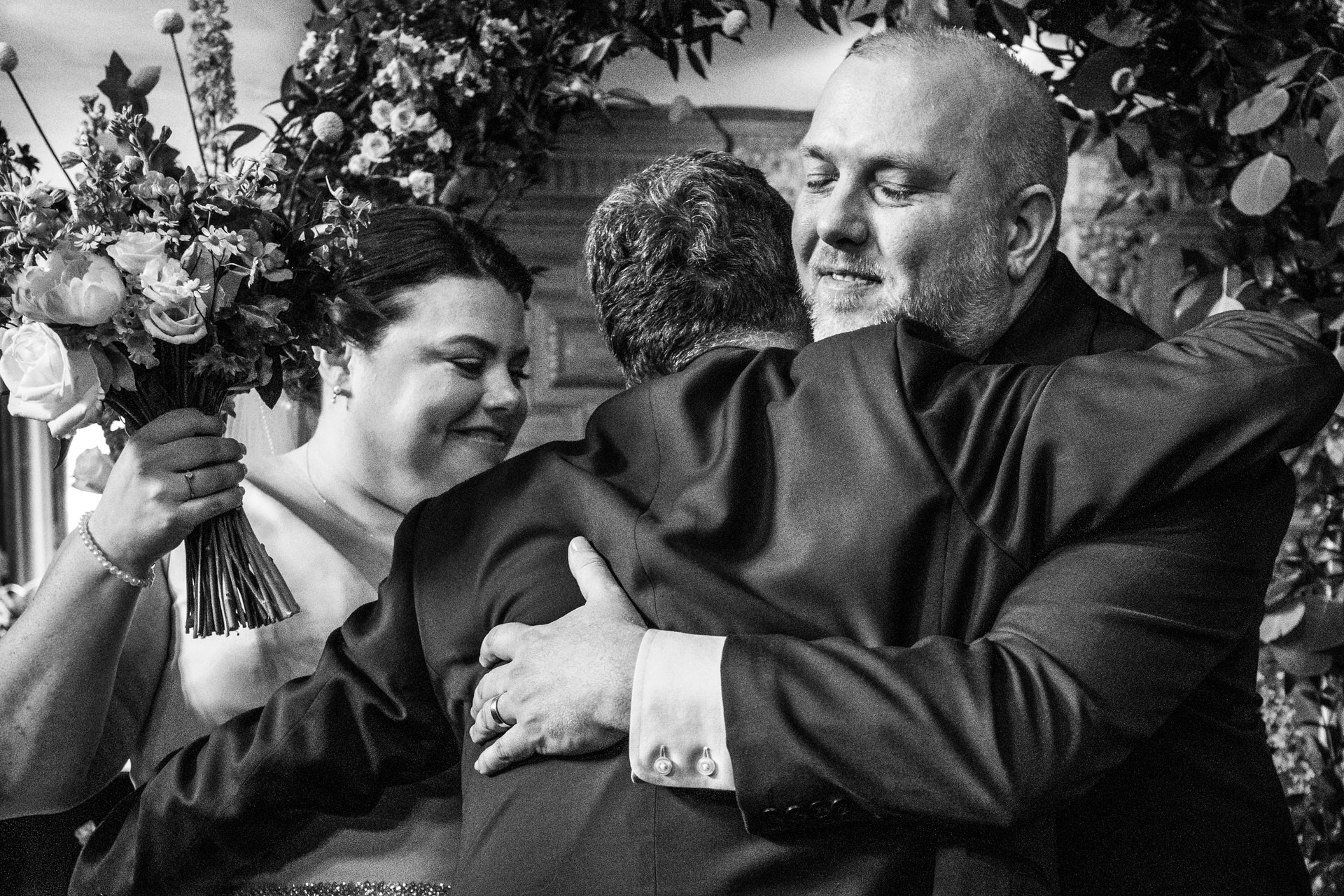 Groom hug with father of the bride at Kingswood Art after ceremony